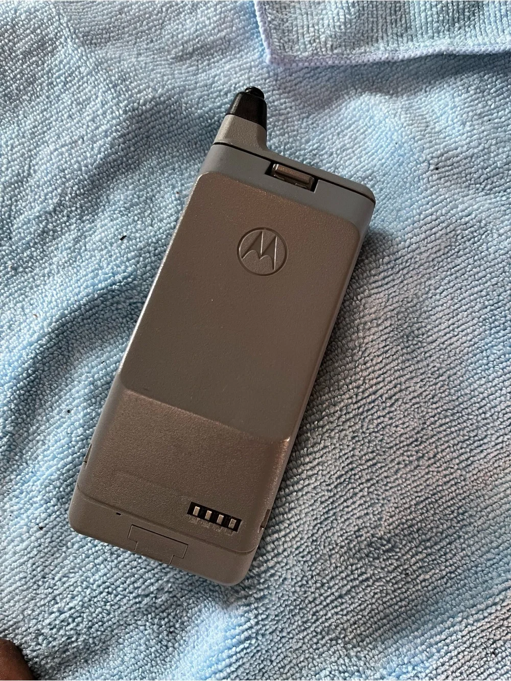 Motorola Silver Flip Phone with Numeric Keypad and Antenna